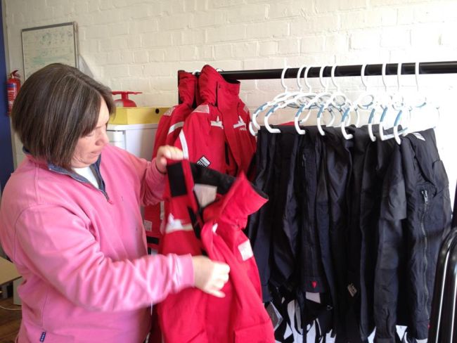 Anne checking the oilskins and storing them Anne checking the oilskins and storing them