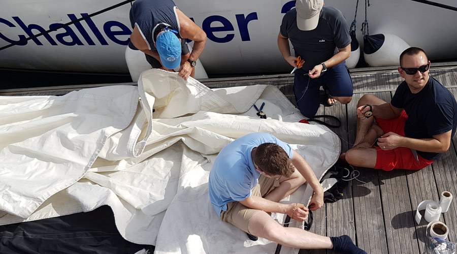 Sail repair - during the day and not on a ship.