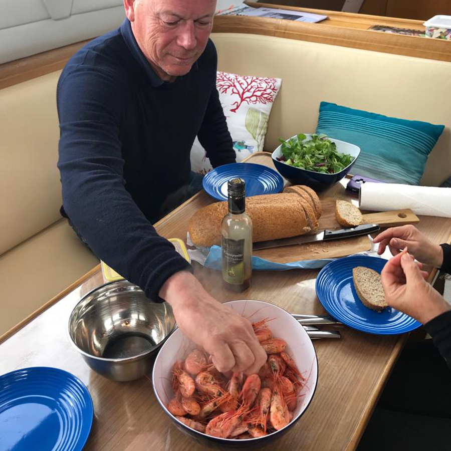 a fishing boat came in ahead of us and immediately a queue formed to buy the catch - litre of freshly caught & cooked prawns