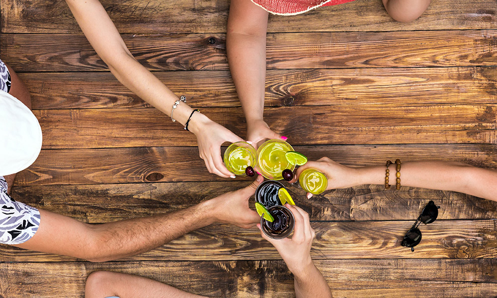 Photo of friends drinking Caribbean rum