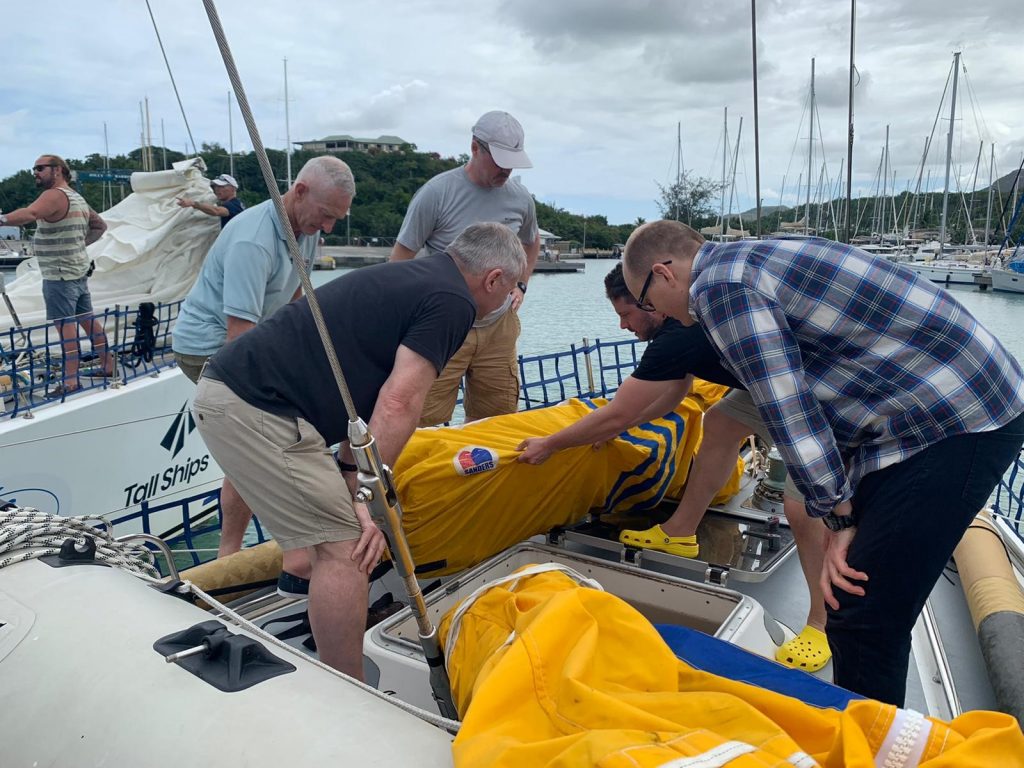Crew checking sails before heading out to sea for training trip