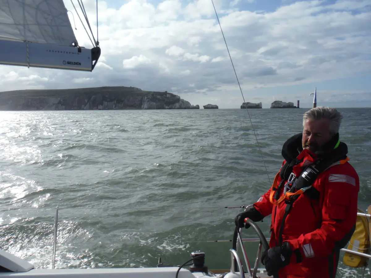 Yacht sailing past the Needles during a Solent sailing weekend