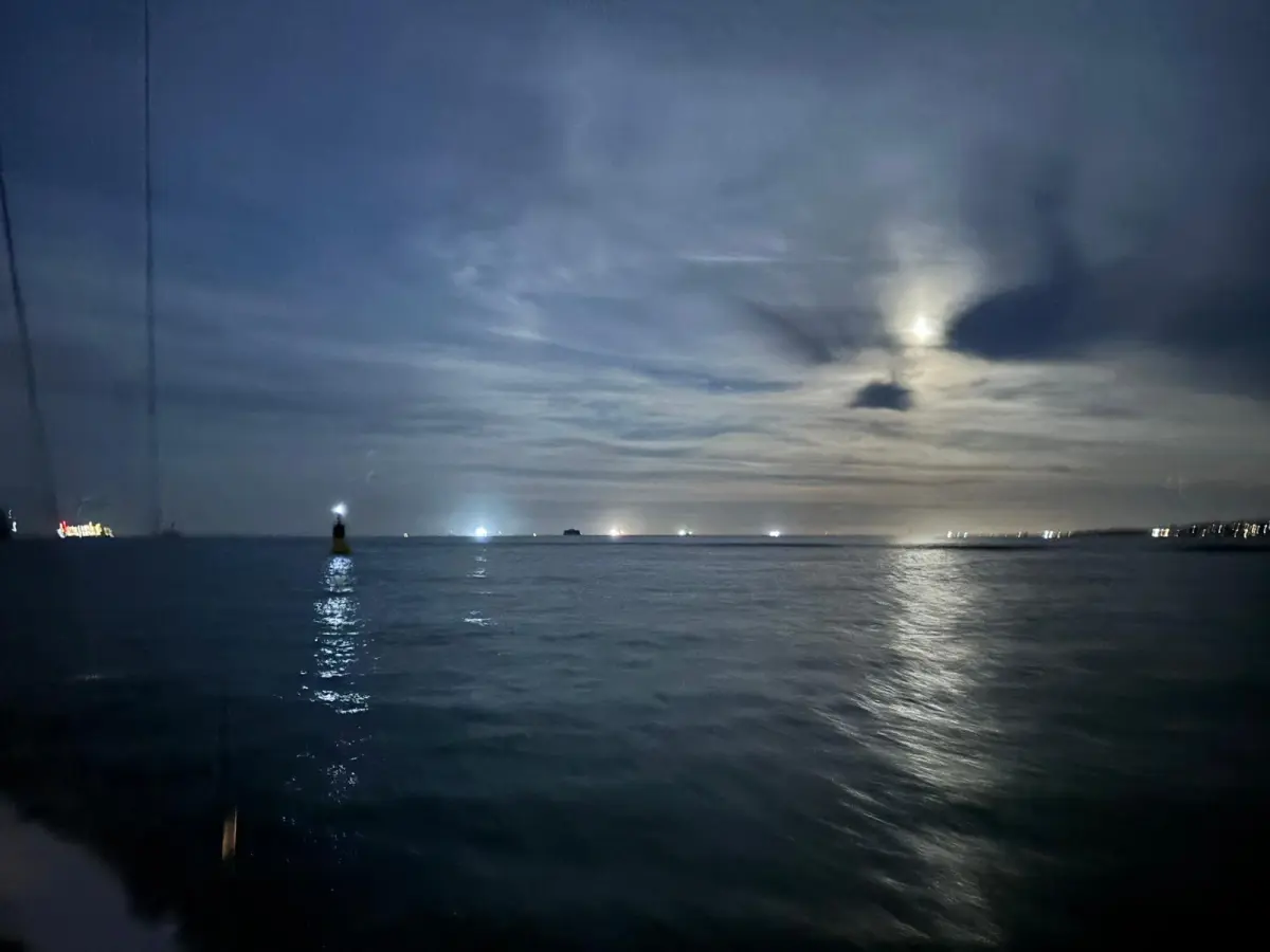 Students practising night sailing on the Solent during an RYA course in autumn.