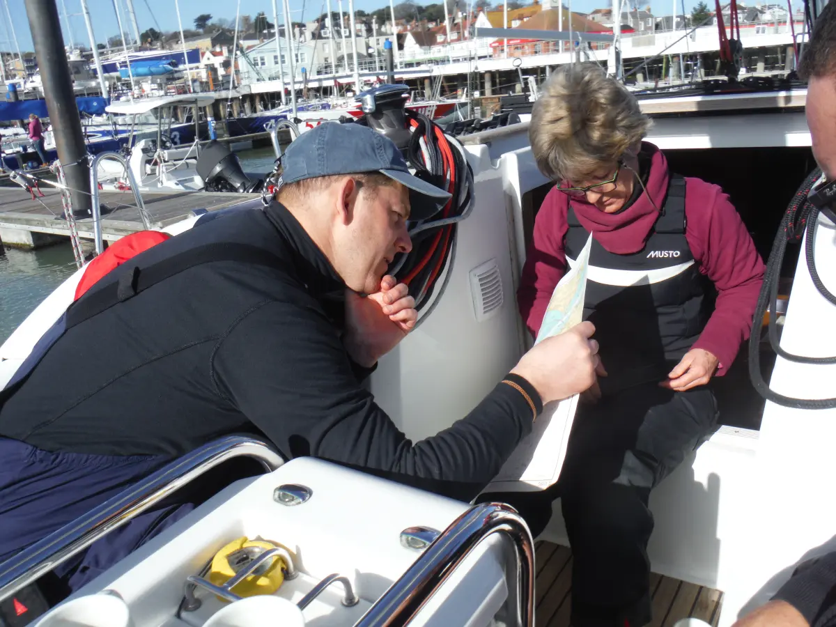 Crew planning passage in tidal waters during a Yachtmaster mile building sailing trip