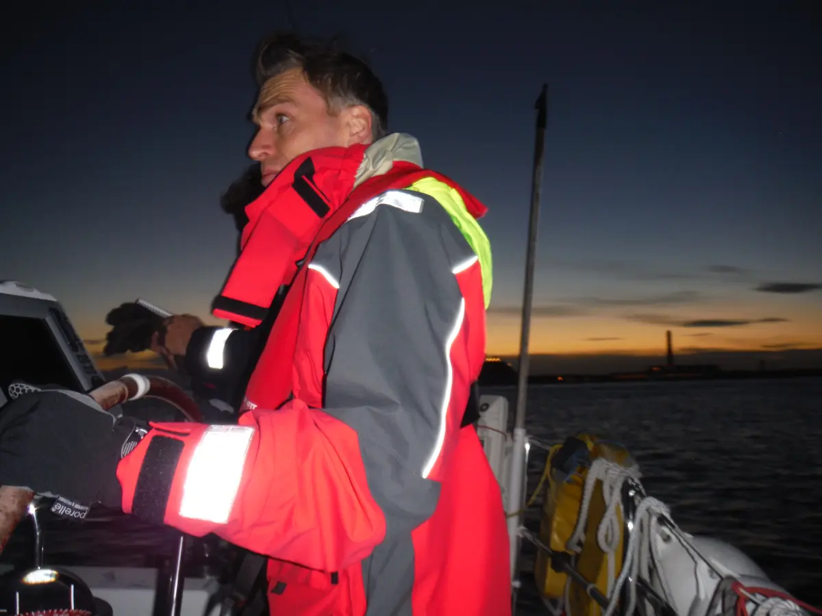 Crew on night watch during offshore Channel Triangle sailing trip