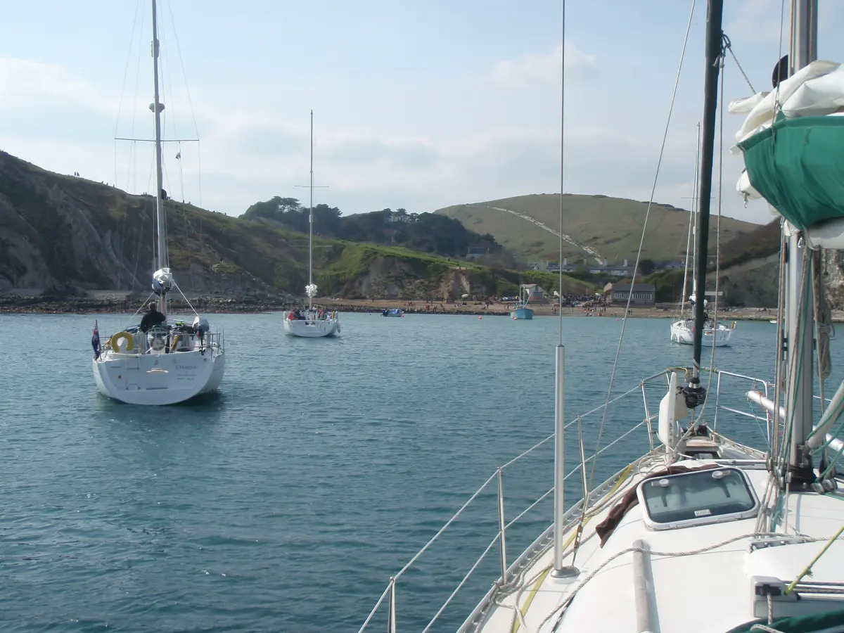 Yacht anchored in Lulworth Cove on Dorset mile building cruise