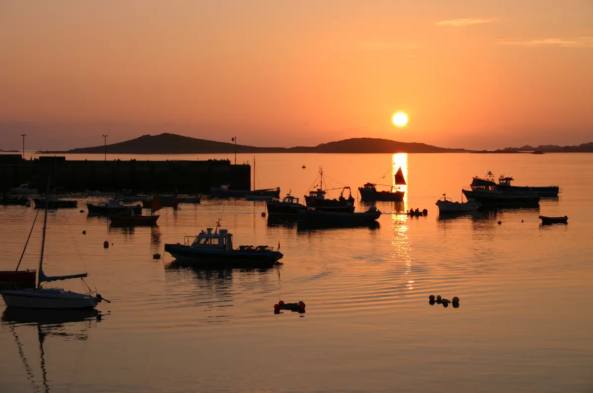 Sunset over the Isles of Scilly during a sailing holiday