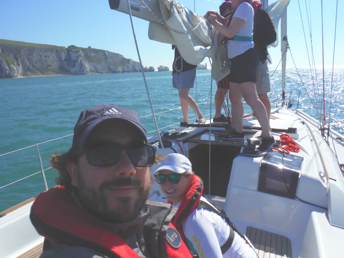 Yacht sailing near the Needles in the summer People enjoying a UK summer sailing holiday near the Isle of Wight
