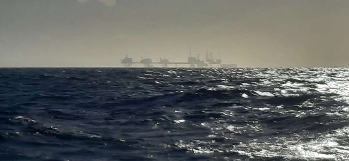 Sailing past oil and gas platforms in the North Sea to Norway