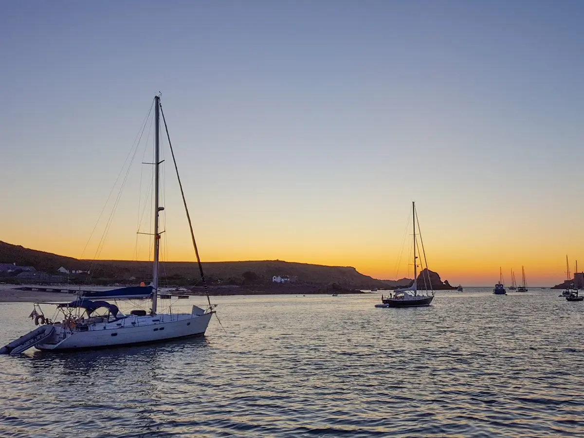 Exploring the Isles of Scilly by yacht - Yachts anchored in the Isles of Scilly during a summer sailing holiday