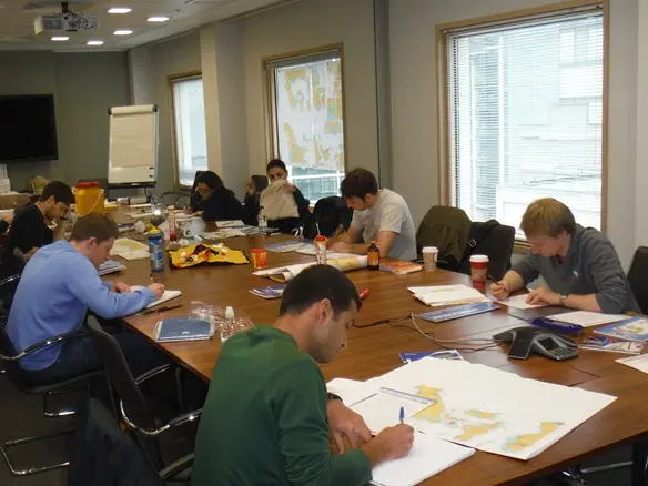 RYA navigation theory class taking place in a London office
