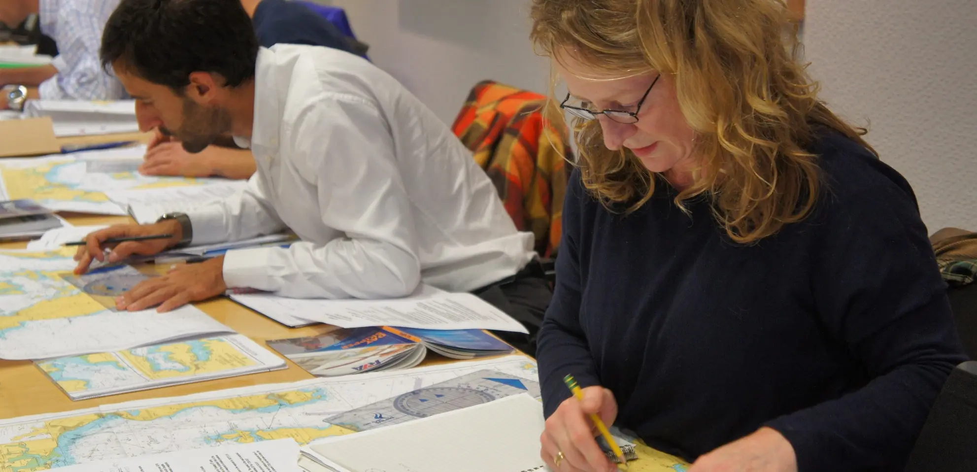 Colleagues learning practical navigation skills together in an office